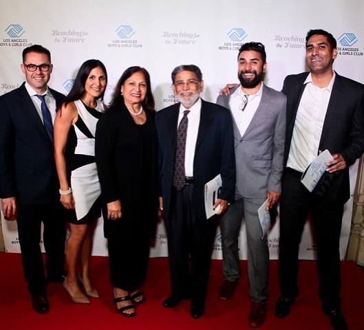 Pictured here is Uka Solanki framed on either side by his beautiful family. His son and a Club Board Member, Harish, is on the far right
